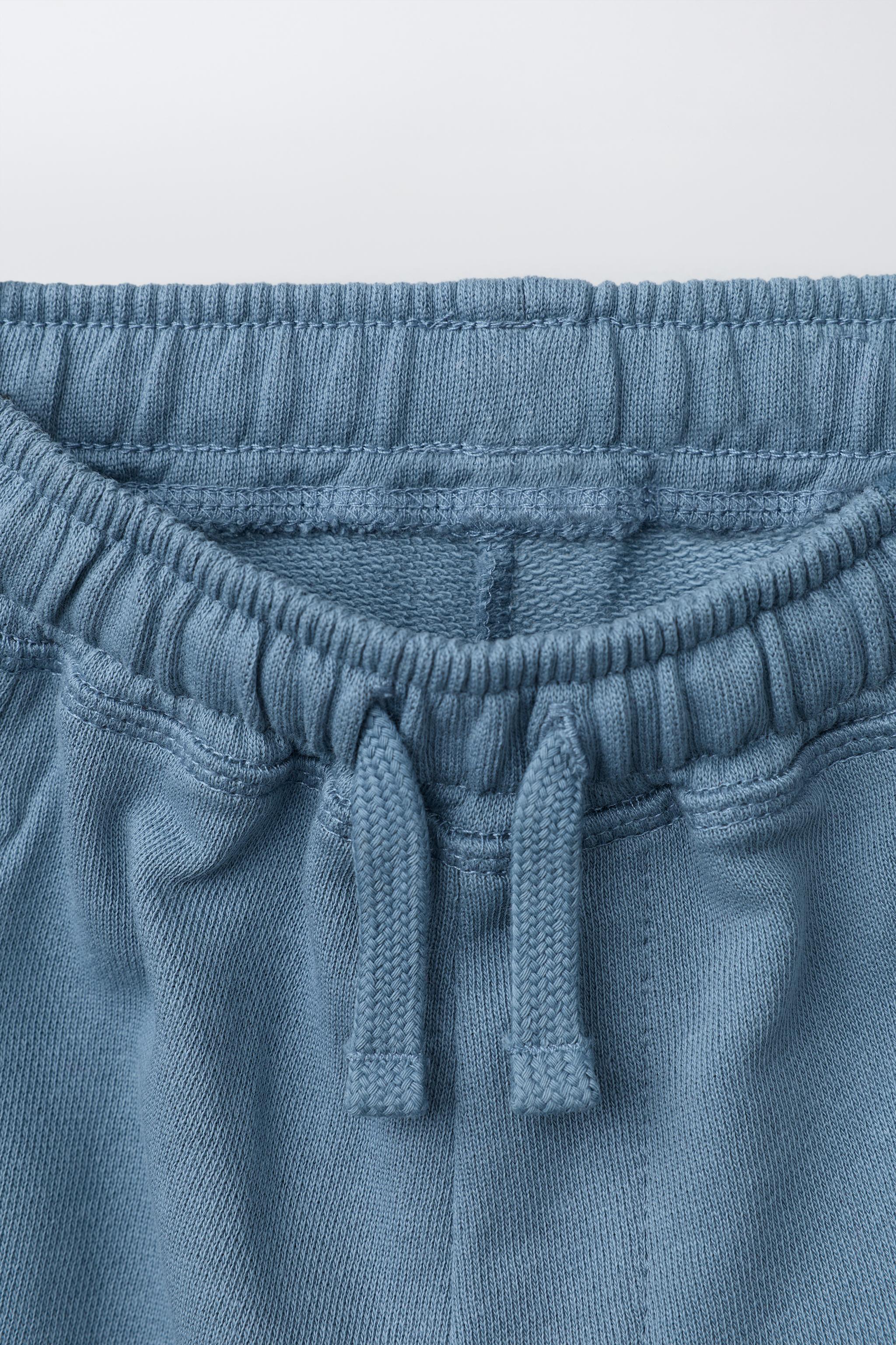 PANTALON BARREL EN MOLLETON AVEC ÉTIQUETTE